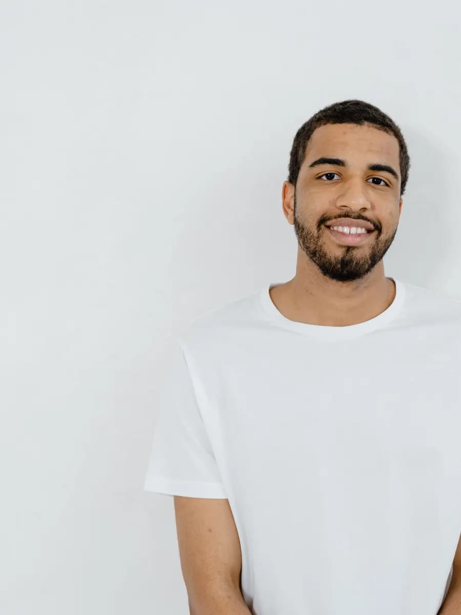 Adult model style reference — Smiling man in blank white t-shirt